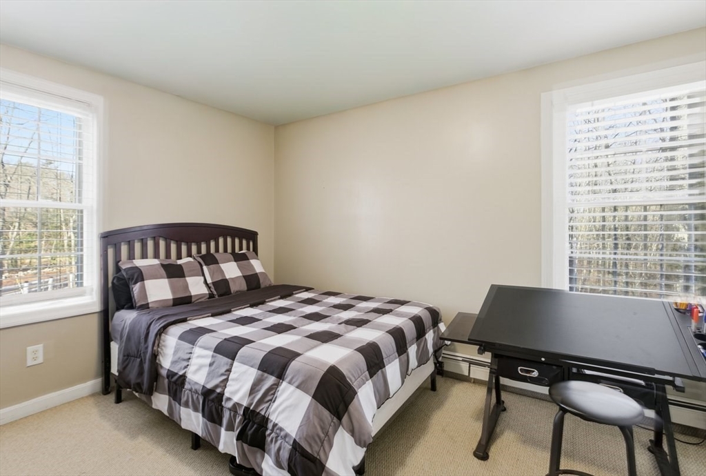 133 Grove Street Bellingham, MA 02019 - Photo 37 of 42 a bedroom with a bed and a window