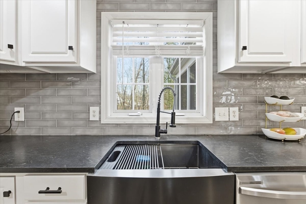 133 Grove Street Bellingham, MA 02019 - Photo 8 of 42 a kitchen with a sink and cabinets