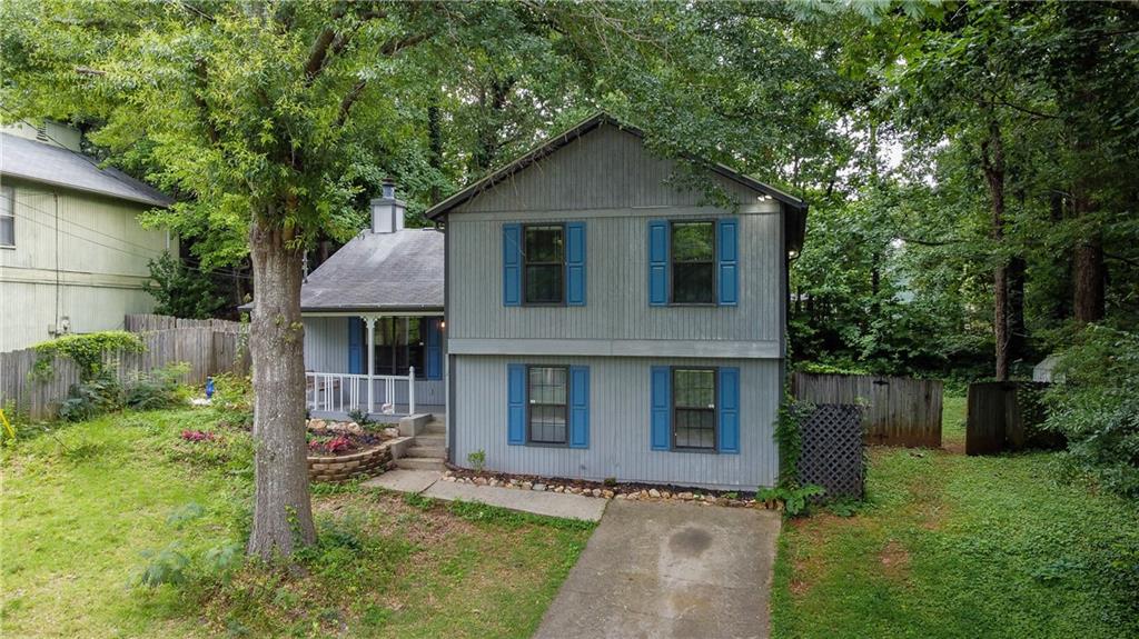 4162 Shiloh Ridge Trail Kennesaw, GA 30144 - Photo 1 of 1 a front view of a house with a yard