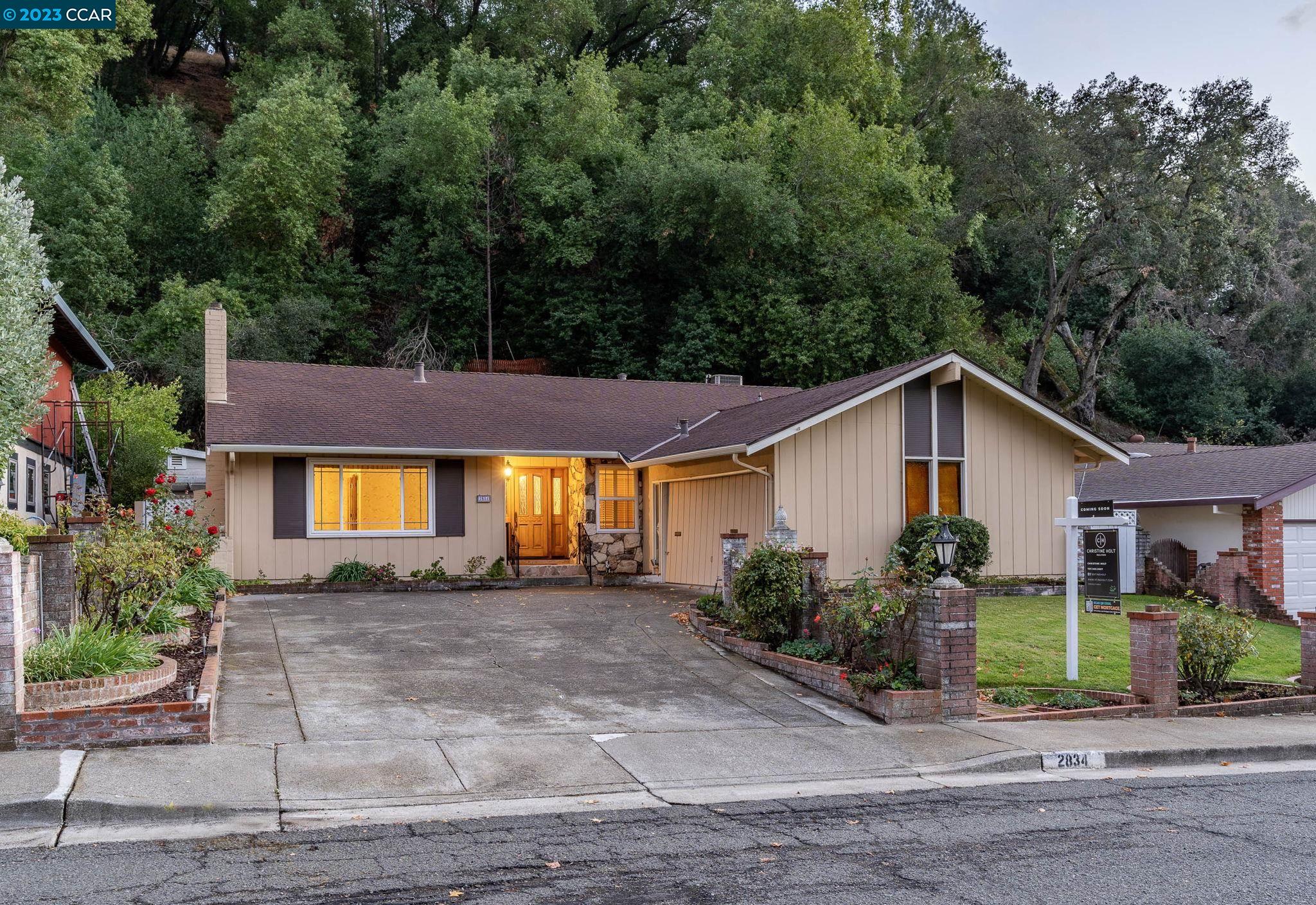 2834 Wright Avenue Pinole, CA 94564 - Photo 1 of 1 a view of a house with a small yard plants and a large tree