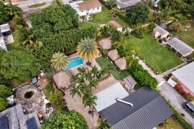 an aerial view of a house with a yard