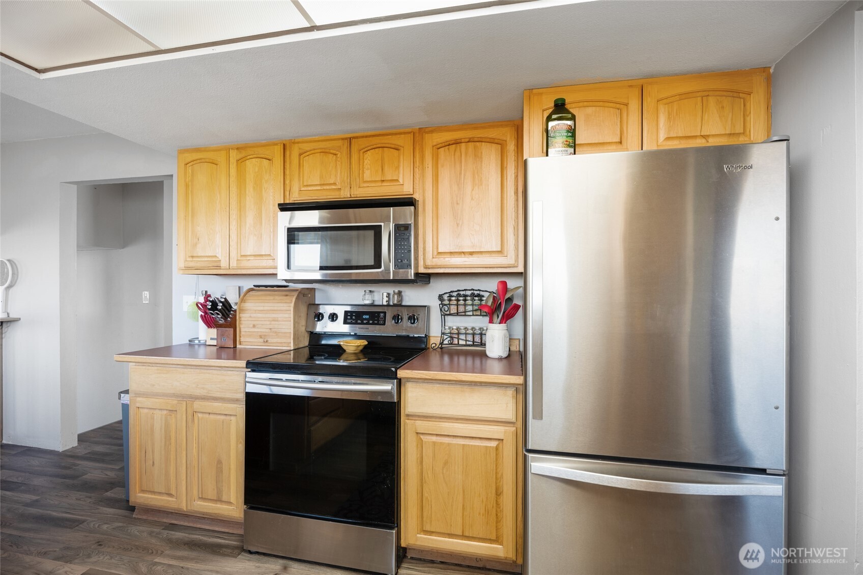 55790 Lake Ridge Lane Electric City, WA 99123 - Photo 11 of 35 a kitchen with a refrigerator sink and microwave
