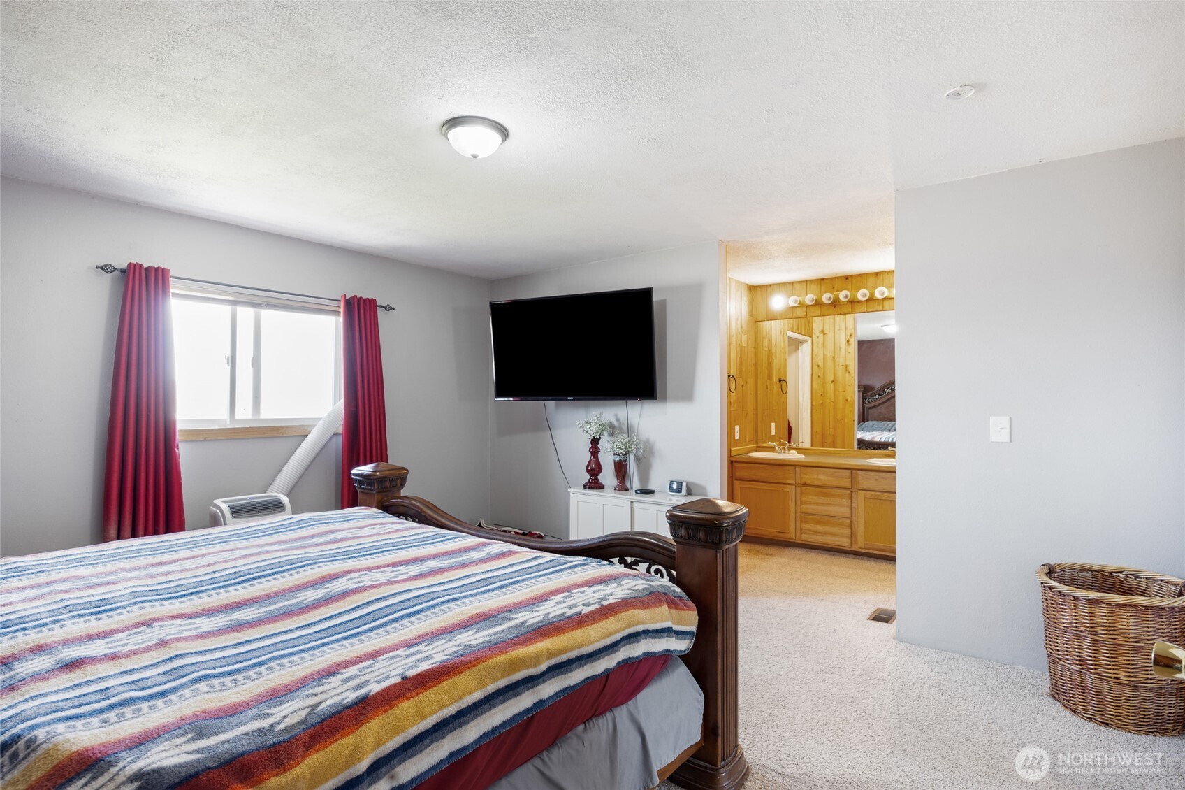 55790 Lake Ridge Lane Electric City, WA 99123 - Photo 18 of 35 a bedroom with a bed and a flat screen tv