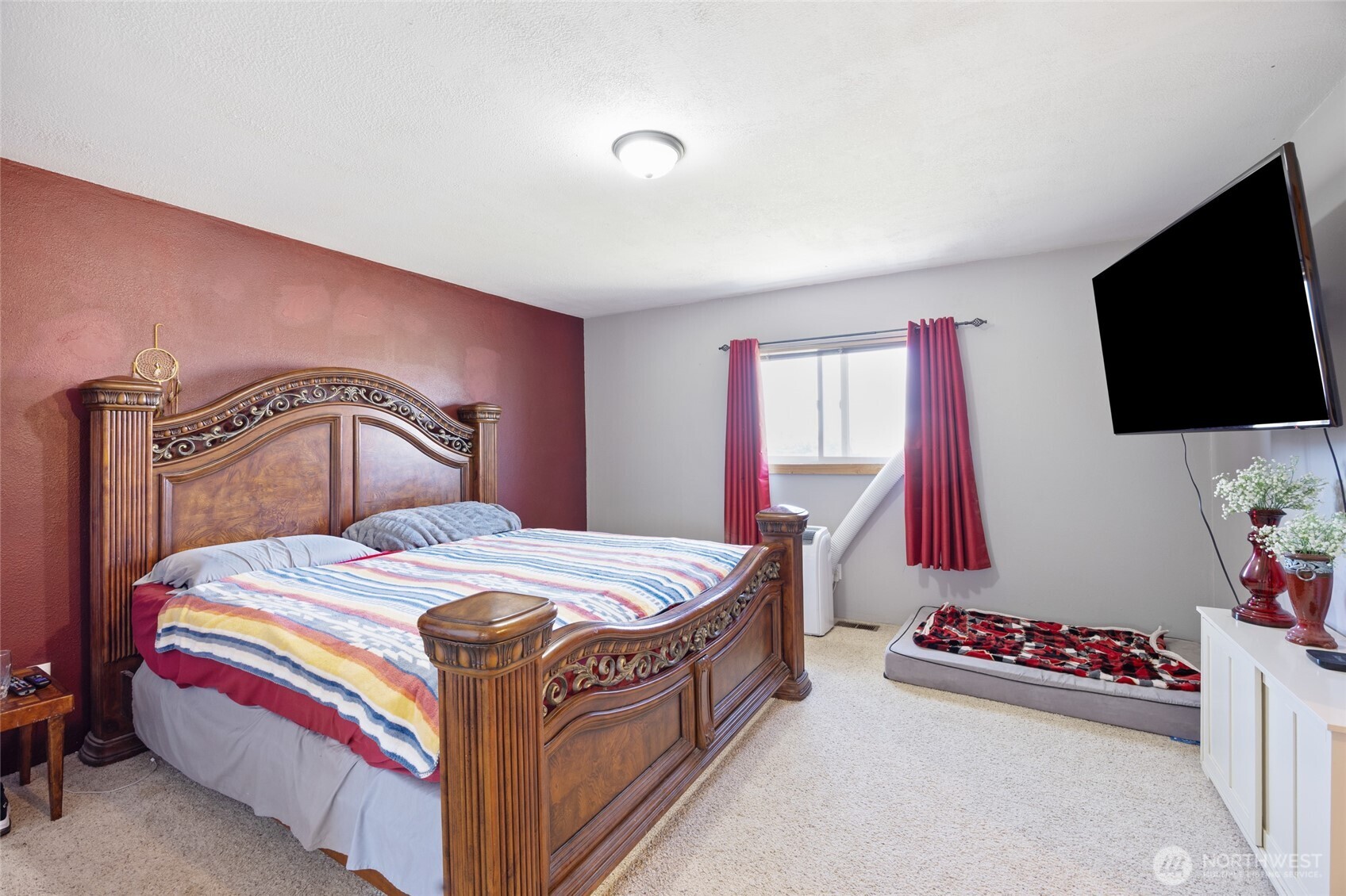 55790 Lake Ridge Lane Electric City, WA 99123 - Photo 19 of 35 a bedroom with a bed and a flat screen tv