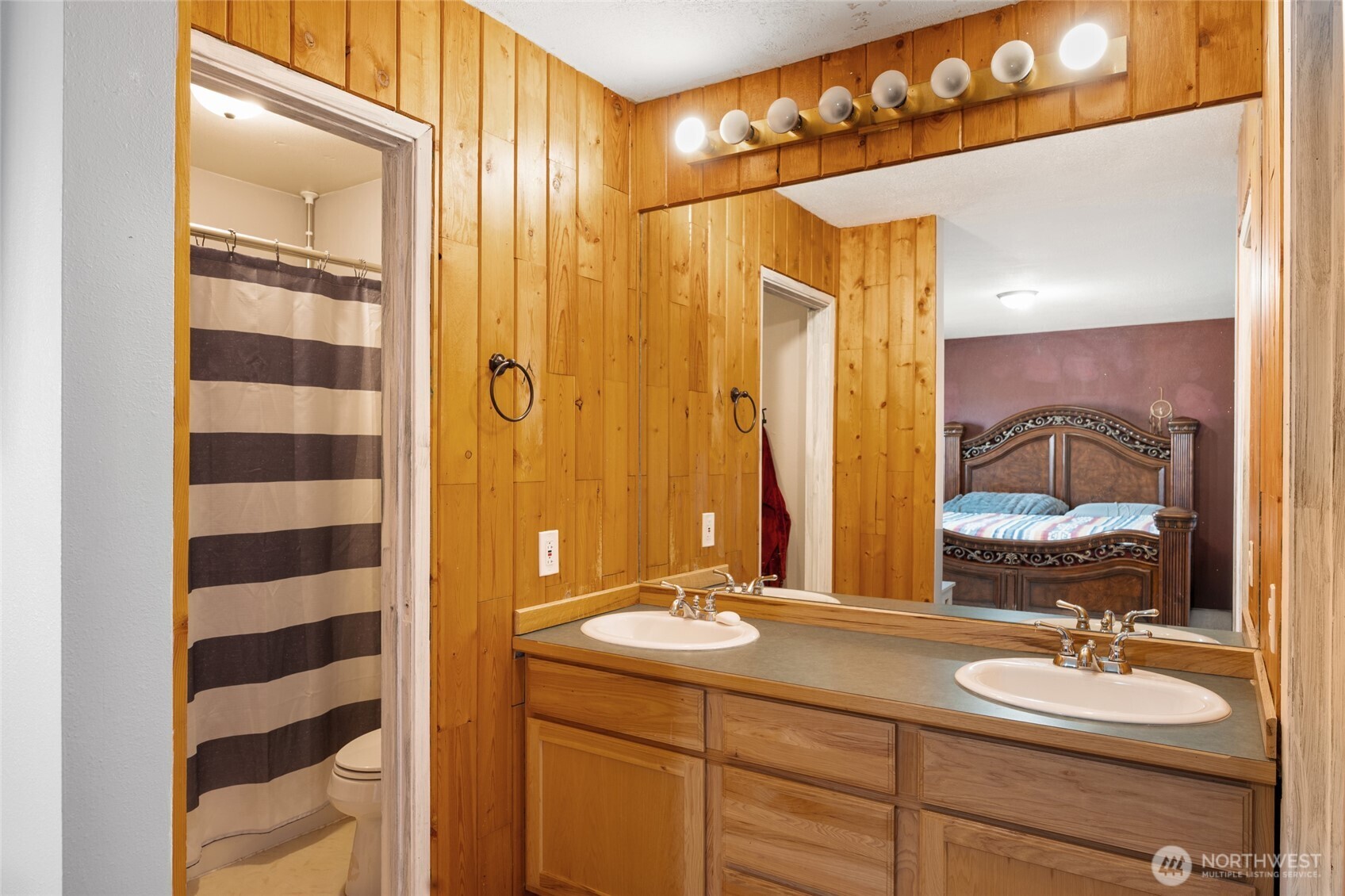 55790 Lake Ridge Lane Electric City, WA 99123 - Photo 20 of 35 a bathroom with a double vanity sink and a mirror