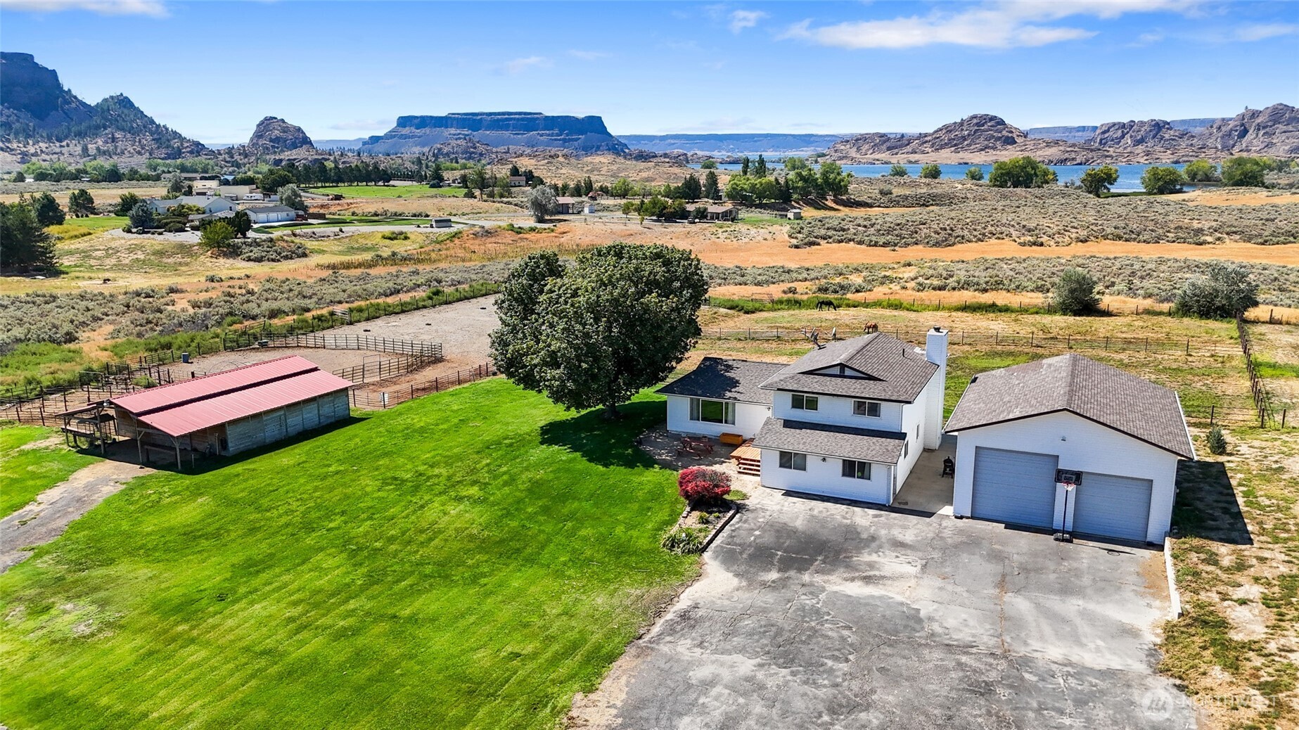 55790 Lake Ridge Lane Electric City, WA 99123 - Photo 2 of 35 an aerial view of residential houses with outdoor space and river