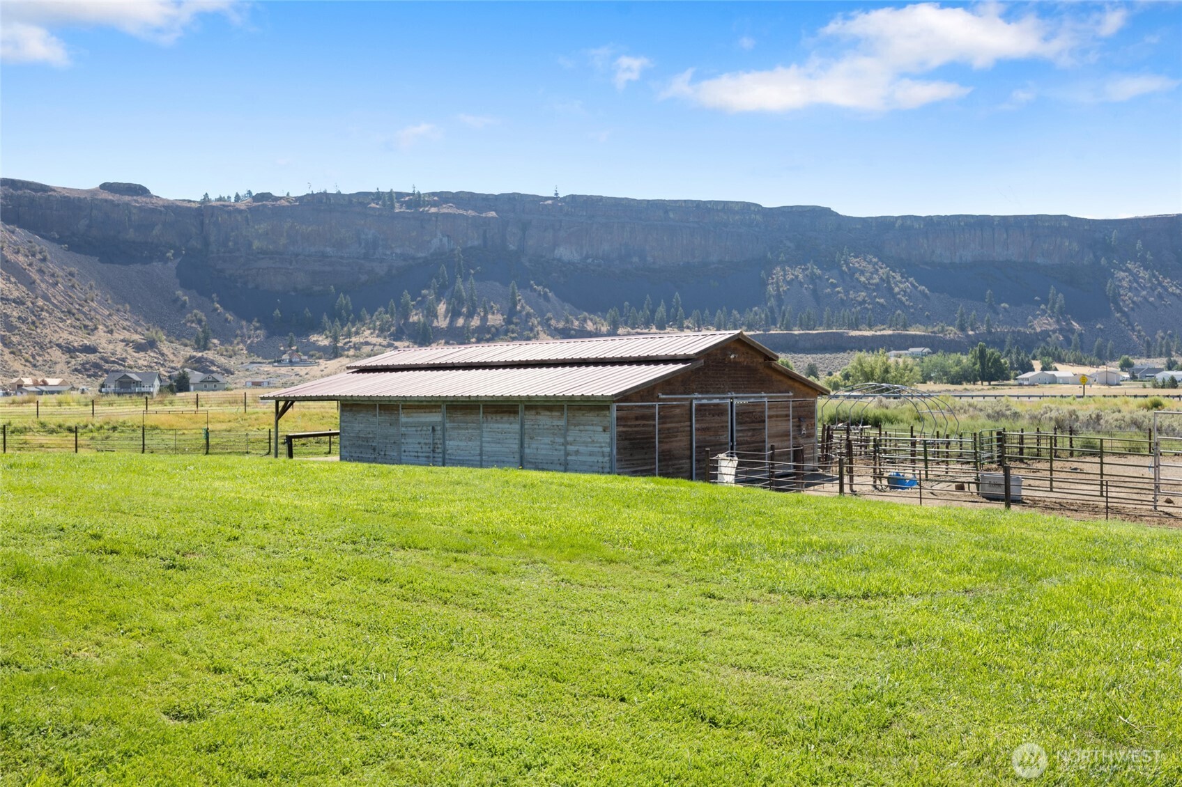 55790 Lake Ridge Lane Electric City, WA 99123 - Photo 27 of 35 a view of a house with a yard and a large tree