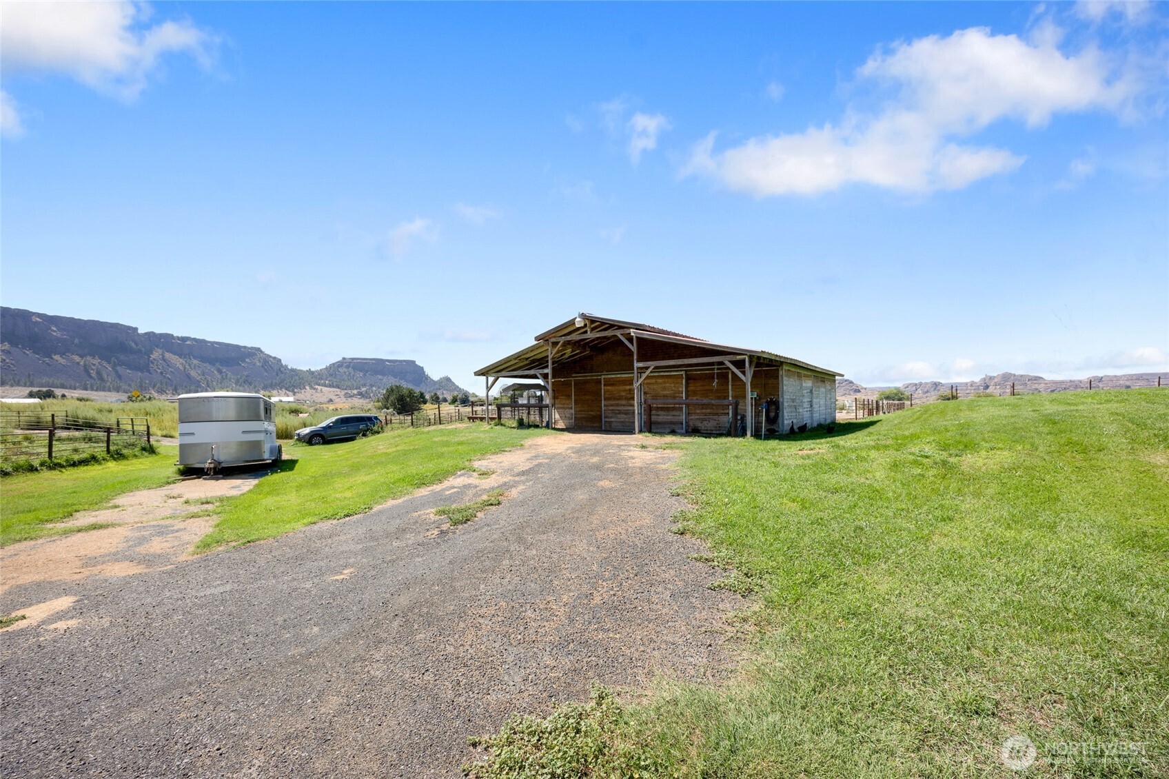 55790 Lake Ridge Lane Electric City, WA 99123 - Photo 31 of 35 a view of a house with a yard and large trees
