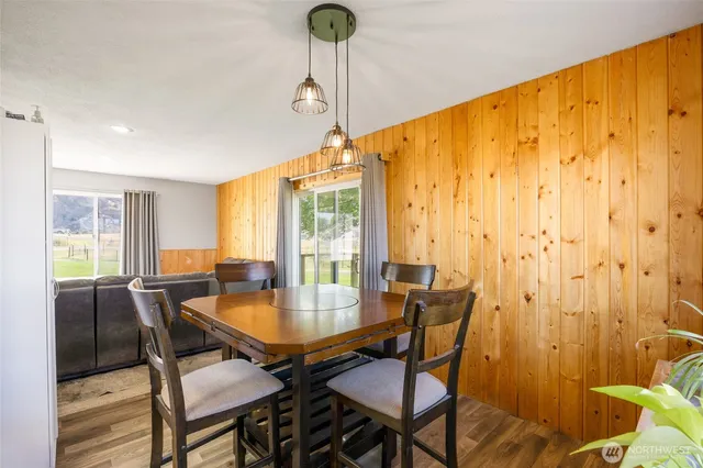 a dining room with furniture and window