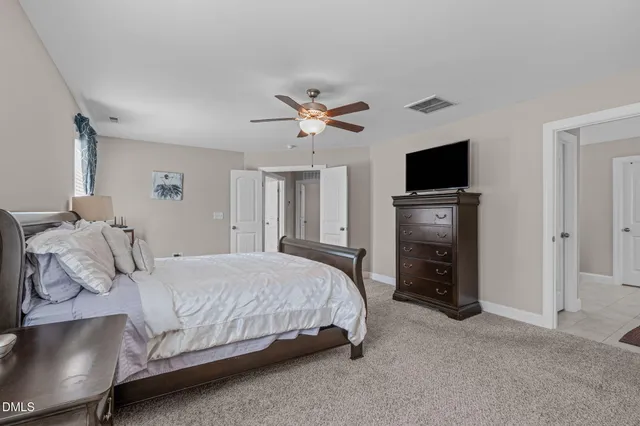 a bathroom with a tub shower and sink
