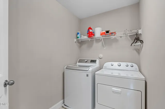 a living room with furniture and a ceiling fan