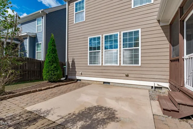 an aerial view of a house with outdoor space