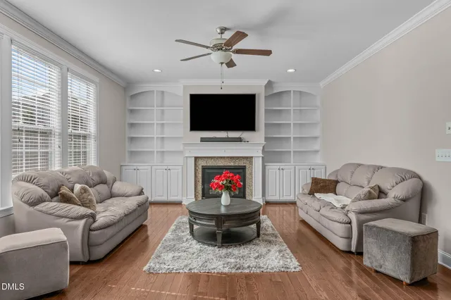 a living room with furniture and kitchen view