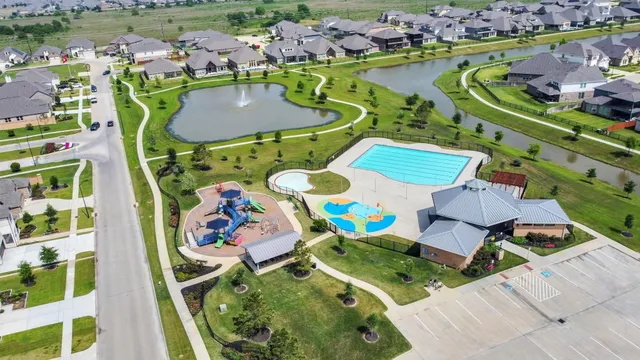 an aerial view of a dining table and chairs with the view of lake view