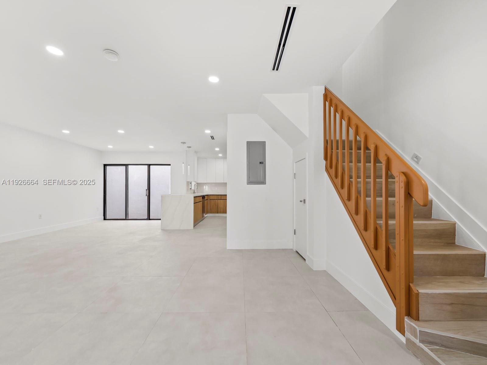 a view of staircase with white walls