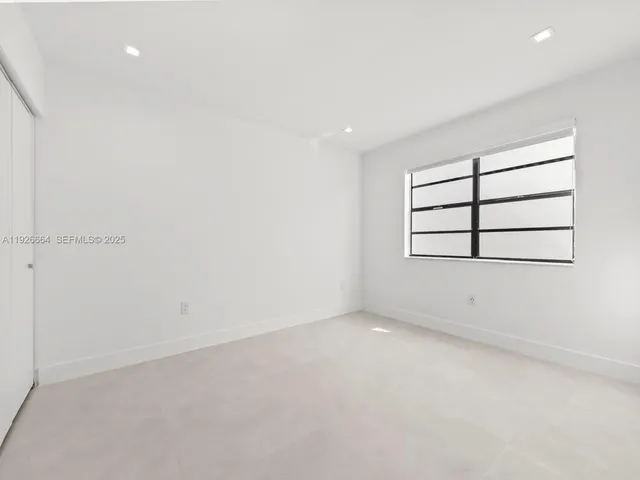 a view of a bathroom from the hallway