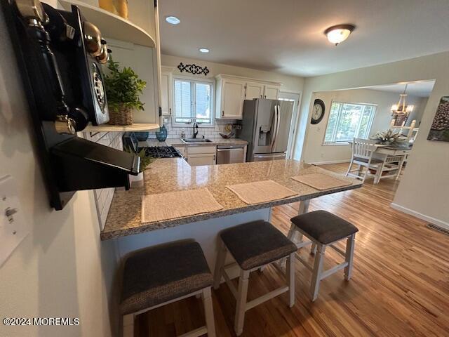 187 Topside Road Manahawkin, NJ 08050 - Photo 19 of 66 a view of kitchen dining table and chairs