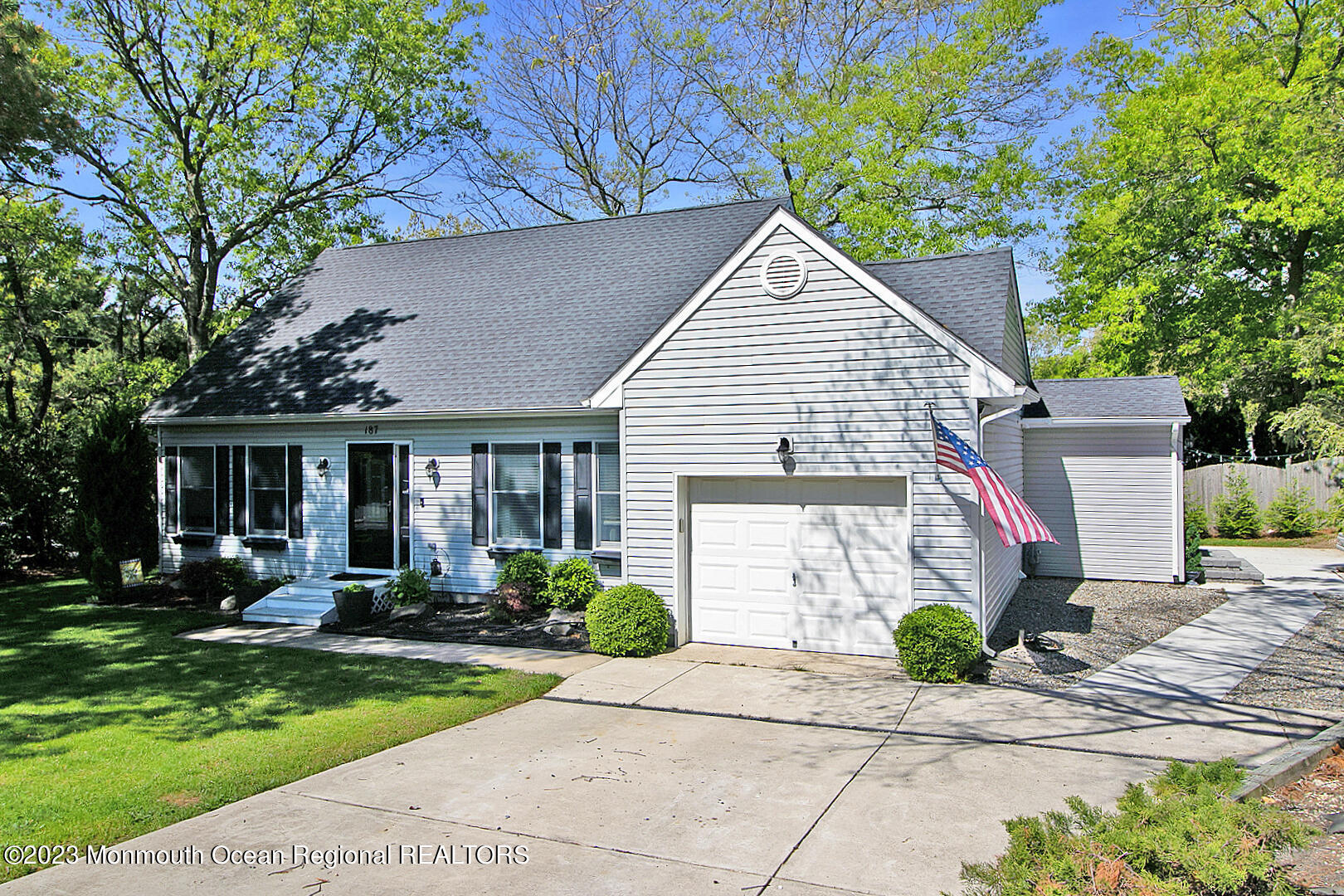 187 Topside Road Manahawkin, NJ 08050 - Photo 3 of 66 a front view of a house with a yard and potted plants