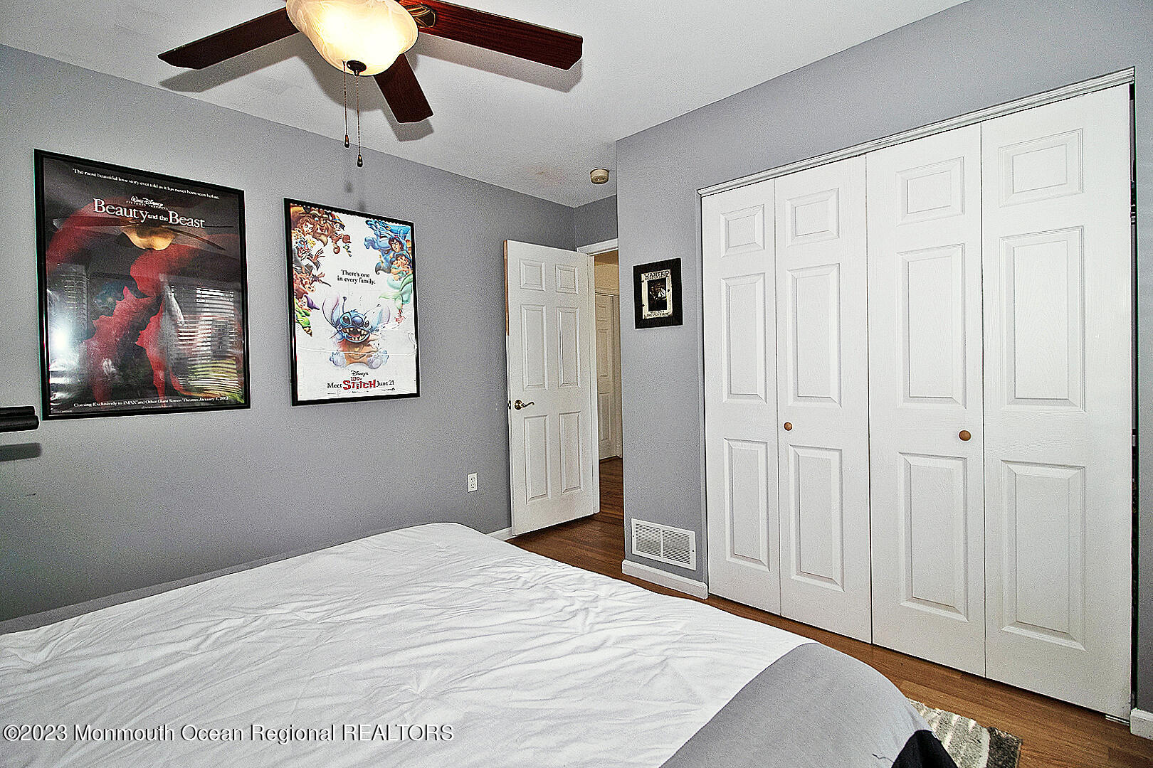 187 Topside Road Manahawkin, NJ 08050 - Photo 33 of 66 a bedroom with a bed and a painting on the wall