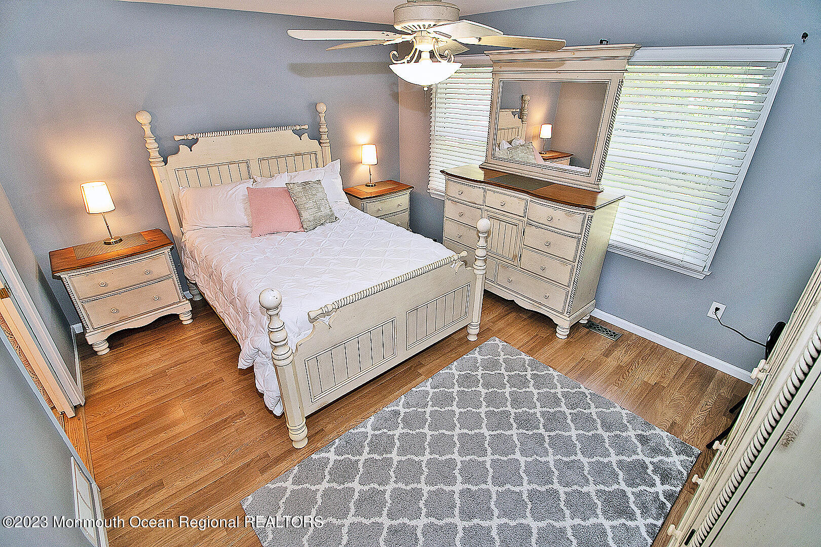 187 Topside Road Manahawkin, NJ 08050 - Photo 35 of 66 a bedroom with a bed and a mirror