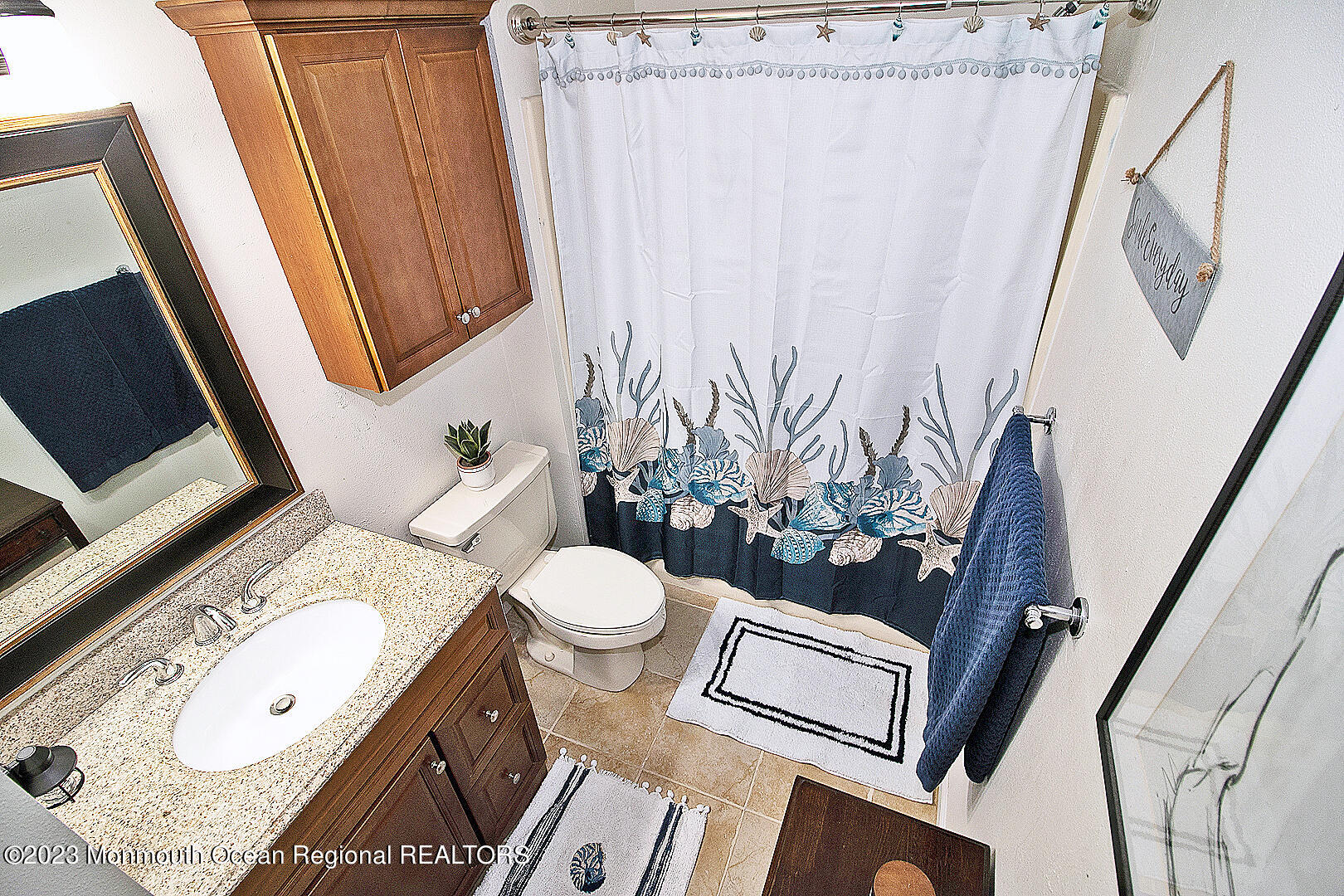 187 Topside Road Manahawkin, NJ 08050 - Photo 40 of 66 a bathroom with a toilet a sink and a mirror