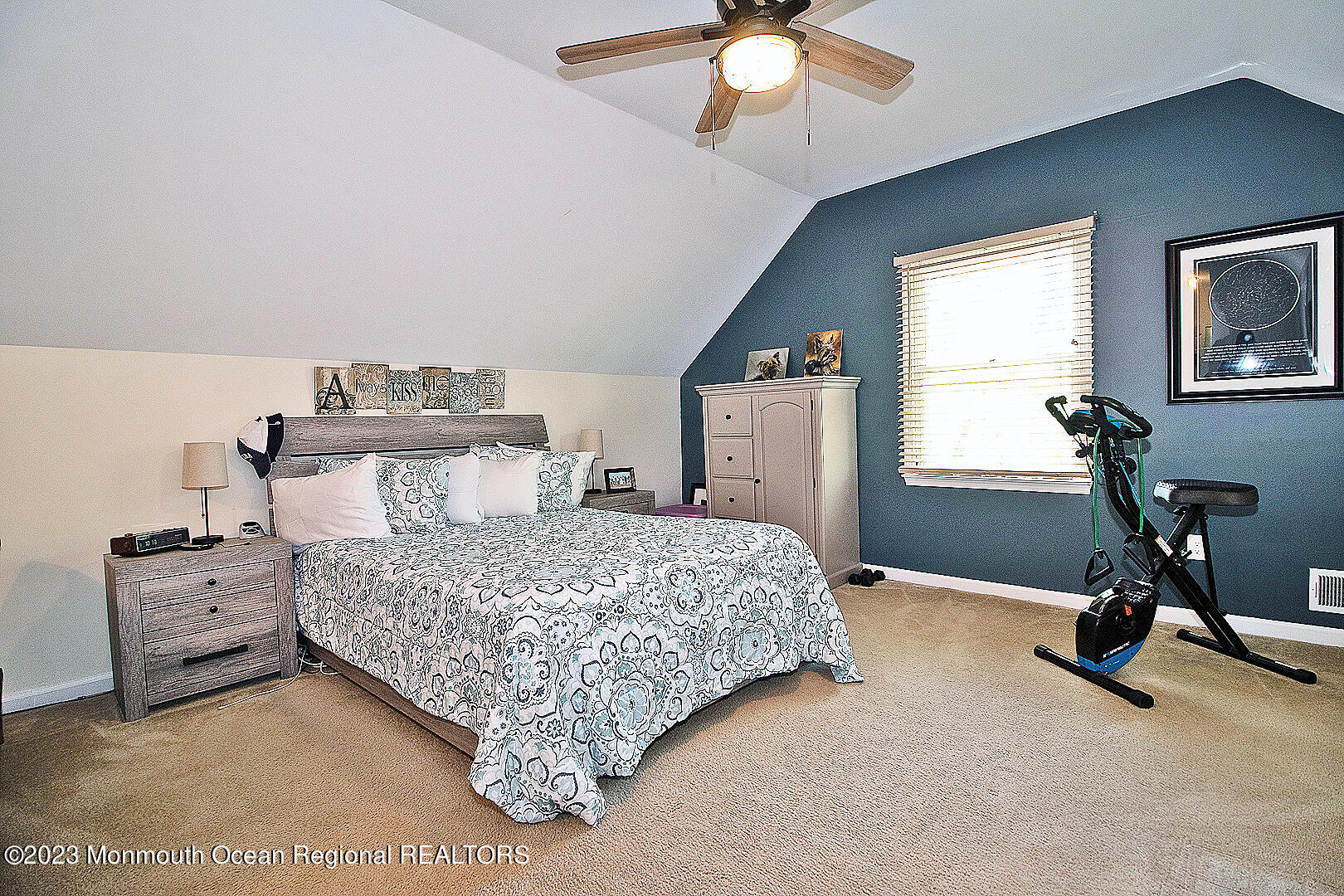 187 Topside Road Manahawkin, NJ 08050 - Photo 50 of 66 a bedroom with a bed and a chandelier
