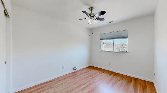 a bathroom with a double vanity sink mirror and toilet