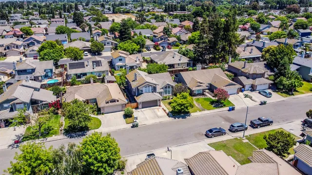an aerial view of a house with yard swimming pool and outdoor seating