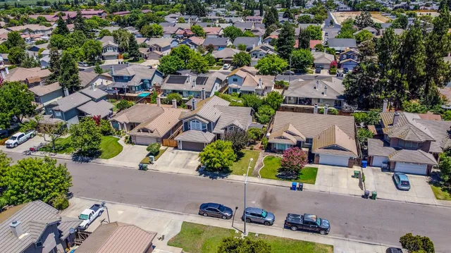 an aerial view of a house with a yard
