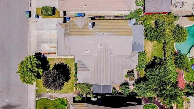 an aerial view of house with a yard