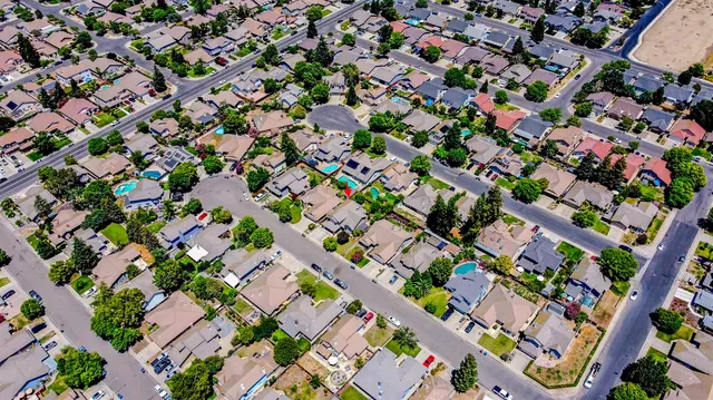 a front view of a house with a yard and a garage
