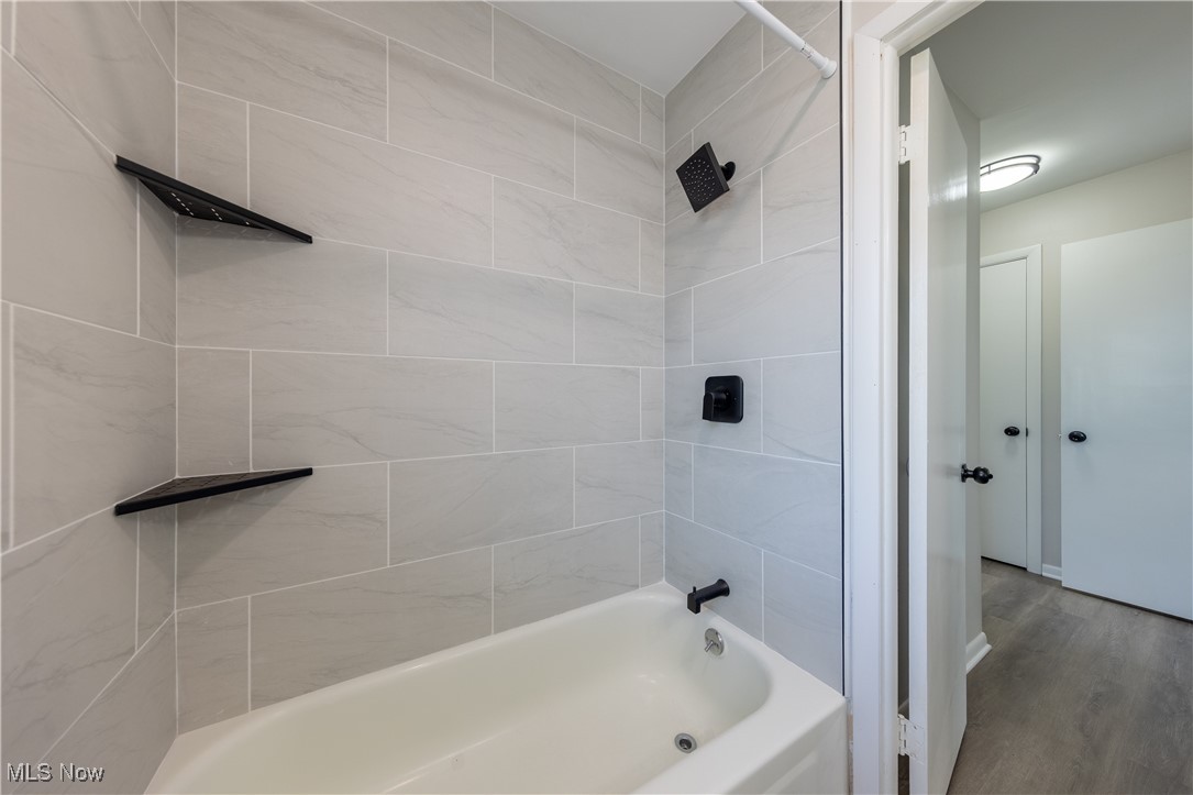 29103 Barjode Road Eastlake, OH 44095 - Photo 11 of 31 Full bathroom featuring shower / bathtub combination and wood finished floors