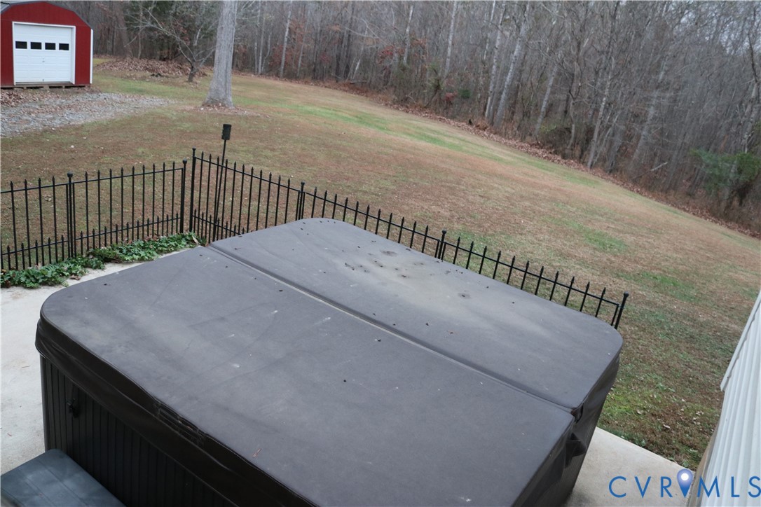 128 Quarry Road Cumberland, VA 23040 - Photo 29 of 36 Wooden terrace featuring a hot tub and a forest vi