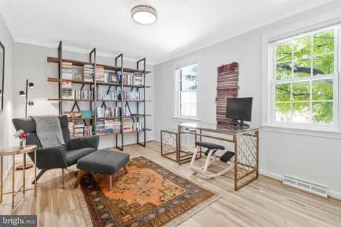 a view of a livingroom with furniture and a flat screen tv