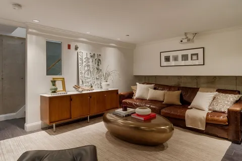 a living room with furniture and window