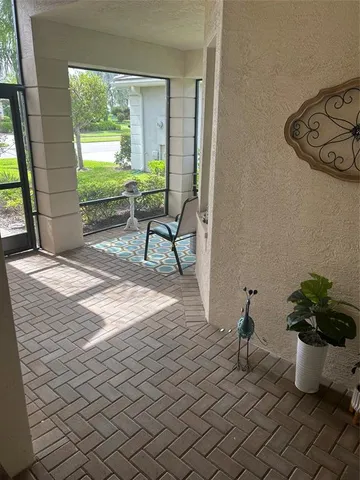 a room with furniture and a potted plant