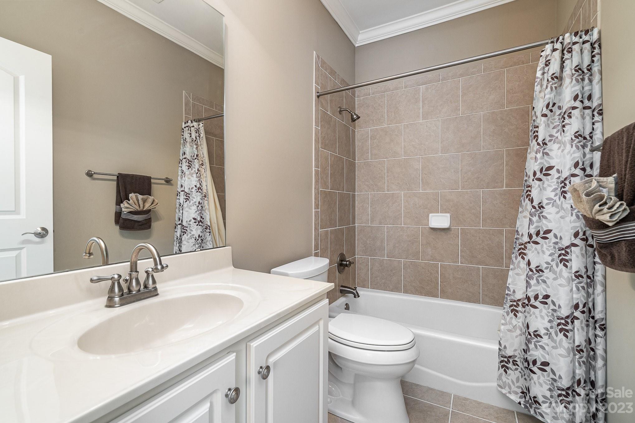 6224 Medlin Road Monroe, NC 28112 - Photo 10 of 21 a bathroom with a sink a toilet and shower