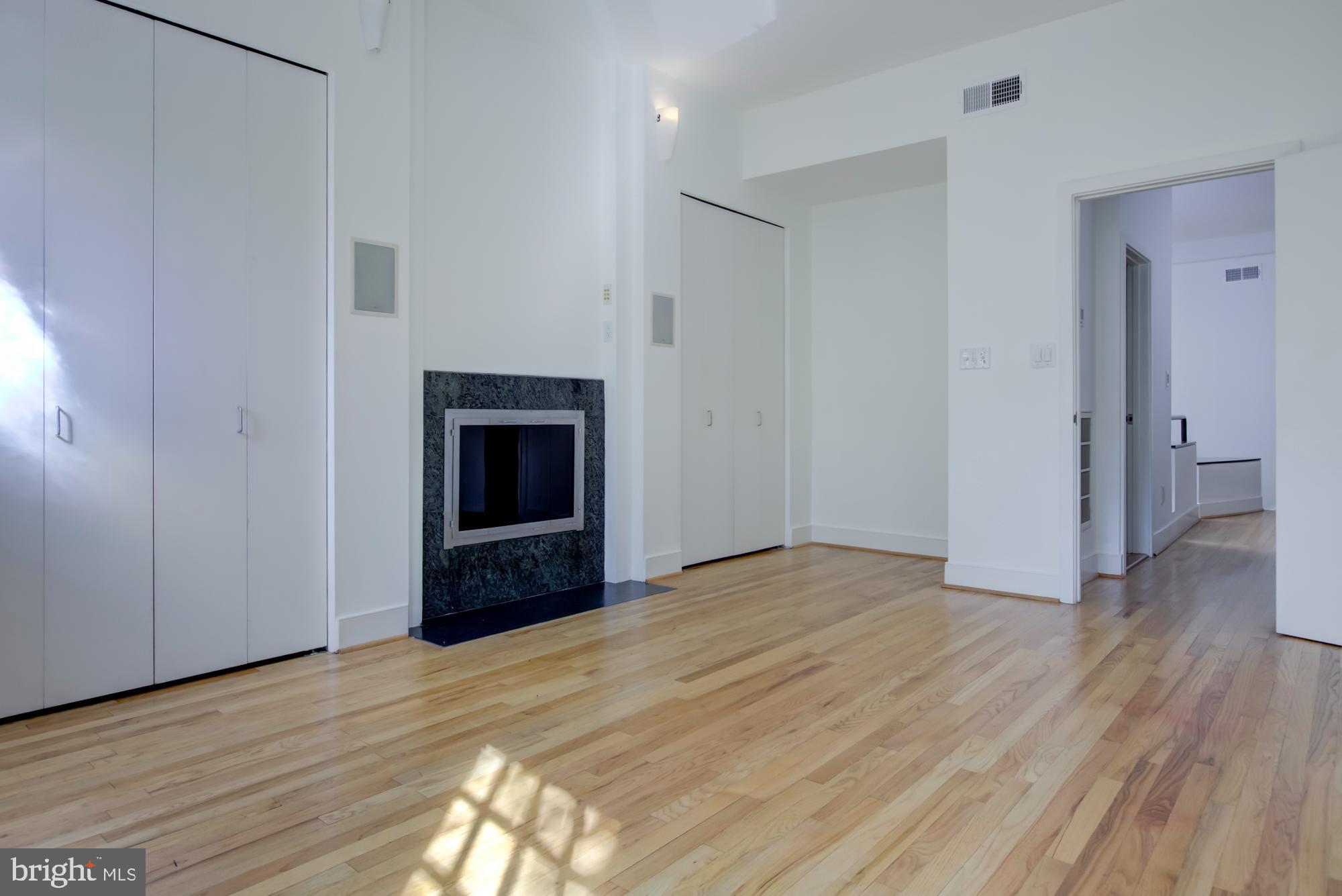 632 C Street Northeast Washington, DC 20002 - Photo 16 of 34 a view of empty room with wooden floor and fireplace
