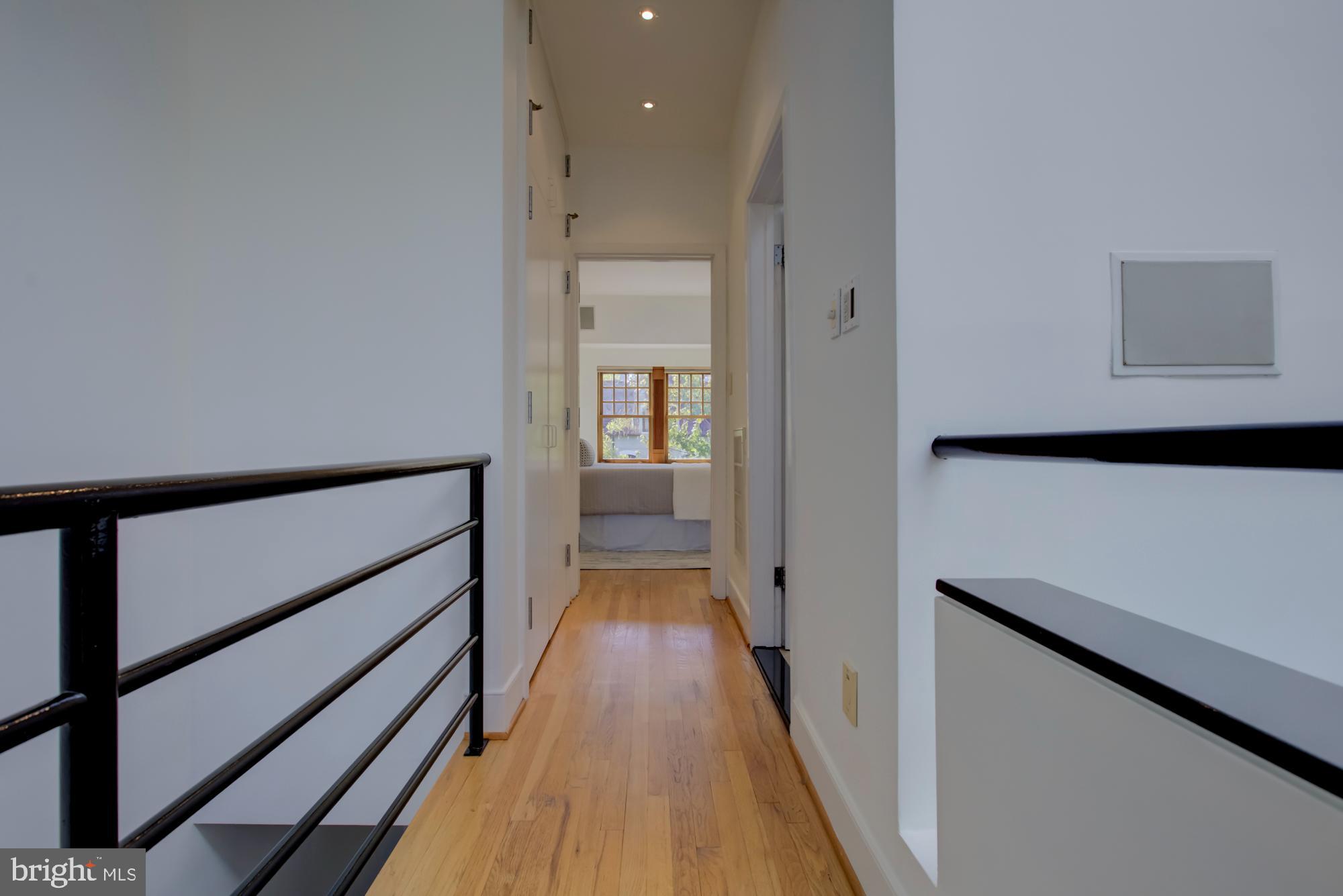 632 C Street Northeast Washington, DC 20002 - Photo 21 of 34 a view of a hallway with wooden floor and staircase