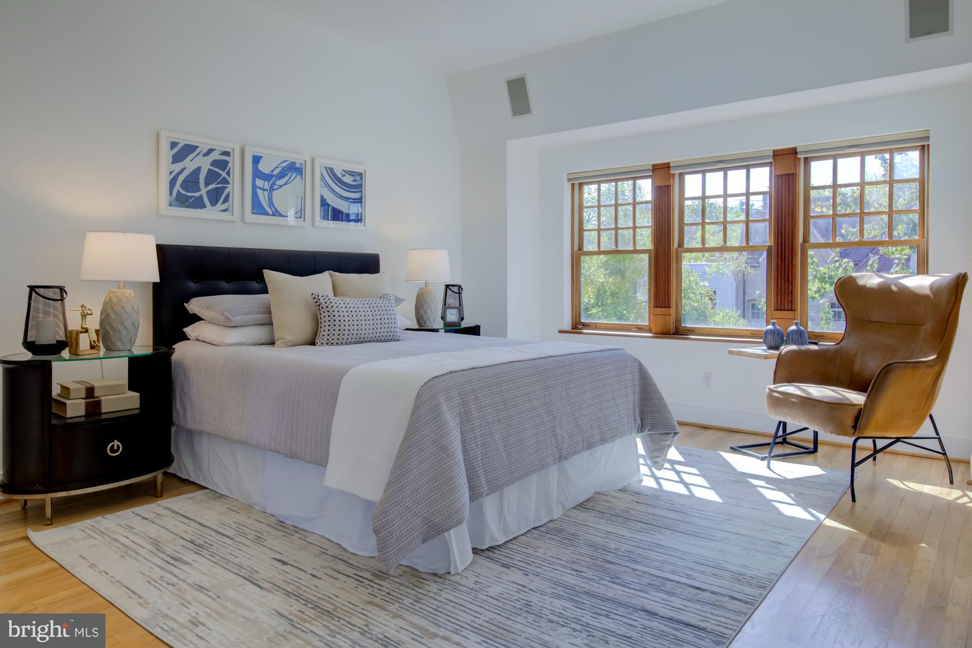 632 C Street Northeast Washington, DC 20002 - Photo 22 of 34 a spacious bedroom with a bed and a large window
