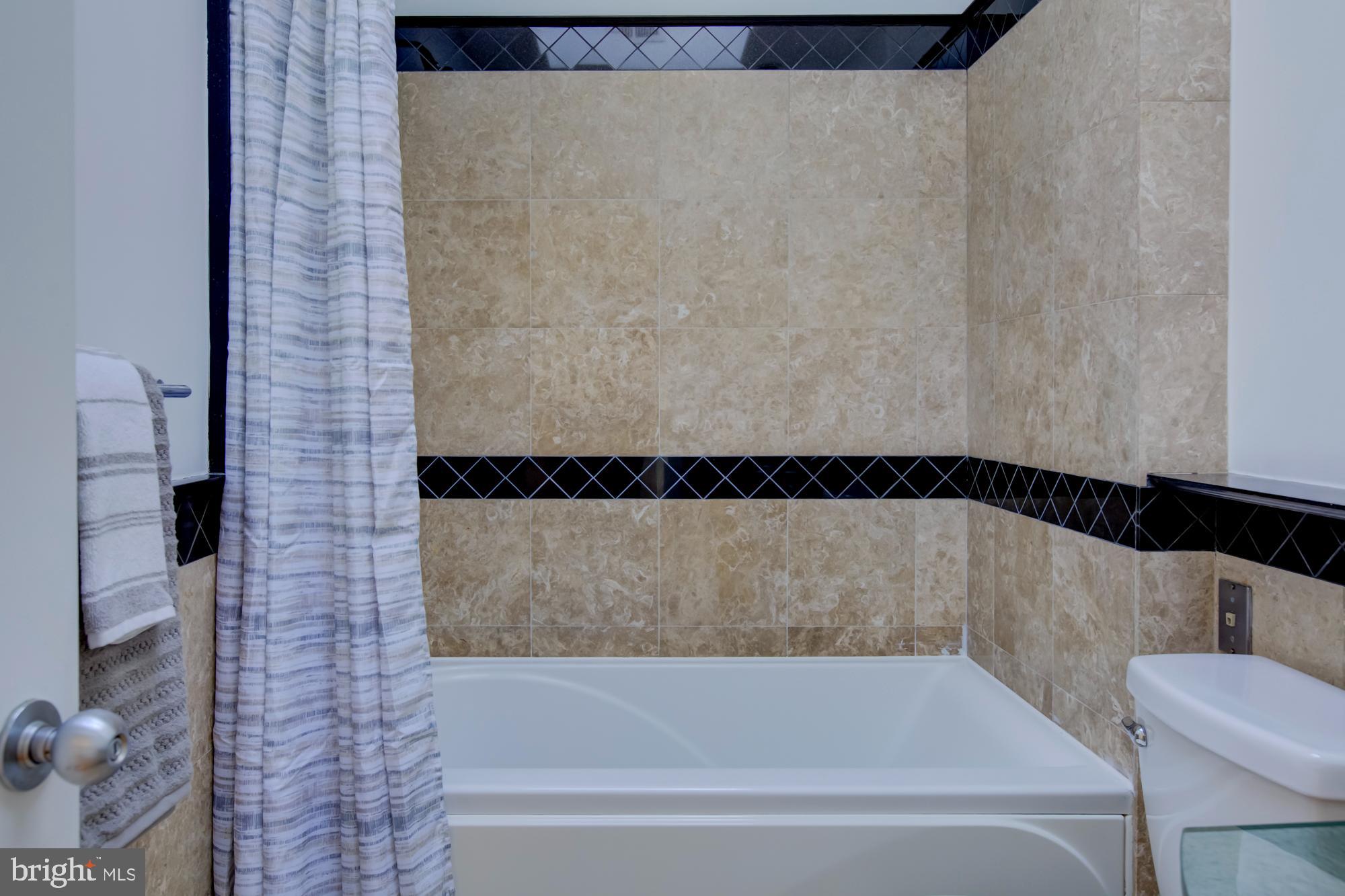 632 C Street Northeast Washington, DC 20002 - Photo 26 of 34 a bathroom with a bathtub and shower