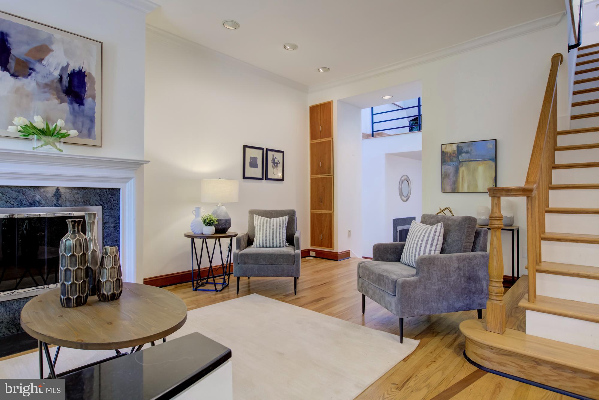 632 C Street Northeast Washington, DC 20002 - Photo 4 of 34 a living room with furniture and a fireplace
