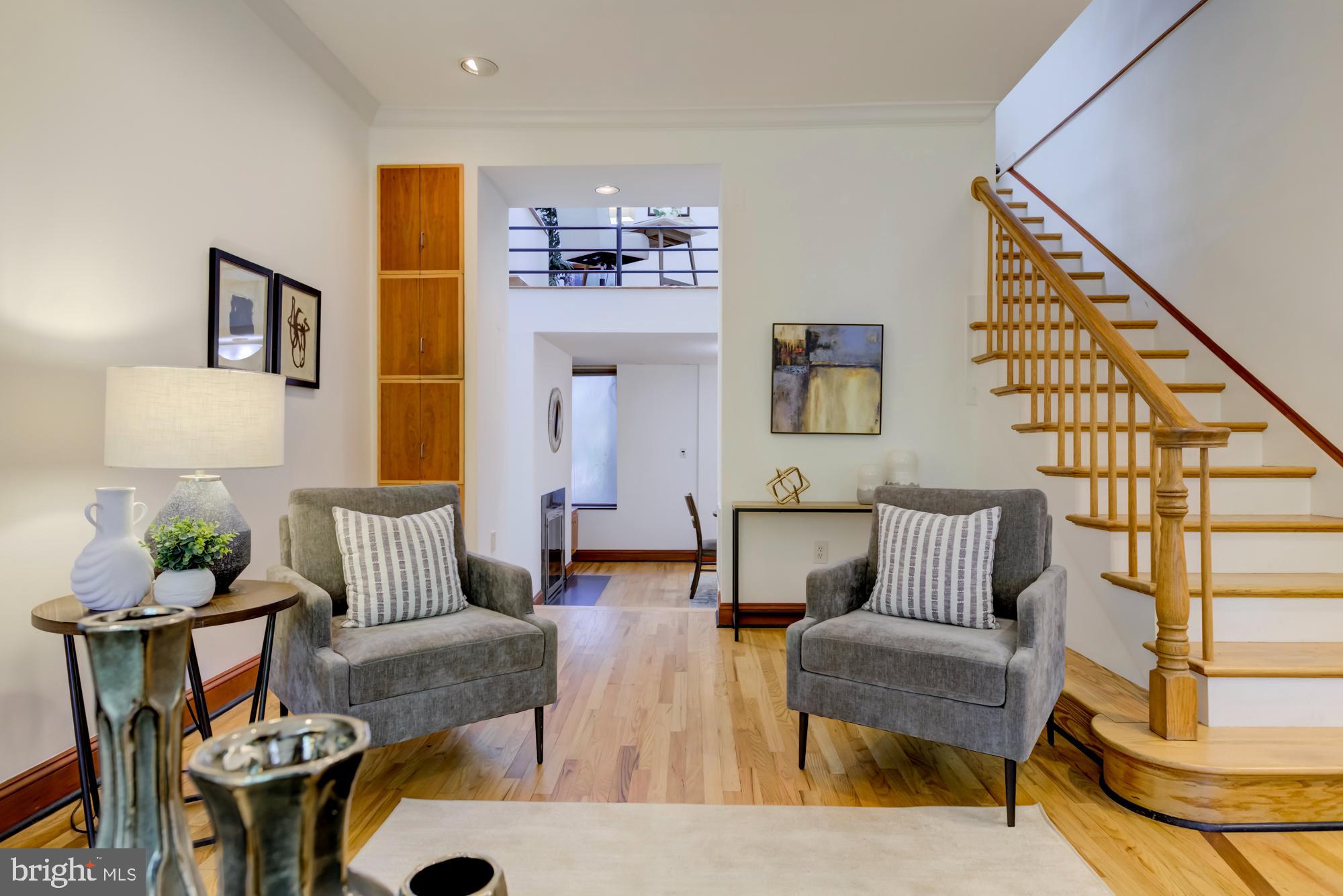 632 C Street Northeast Washington, DC 20002 - Photo 5 of 34 a living room with furniture and a painting on the wall