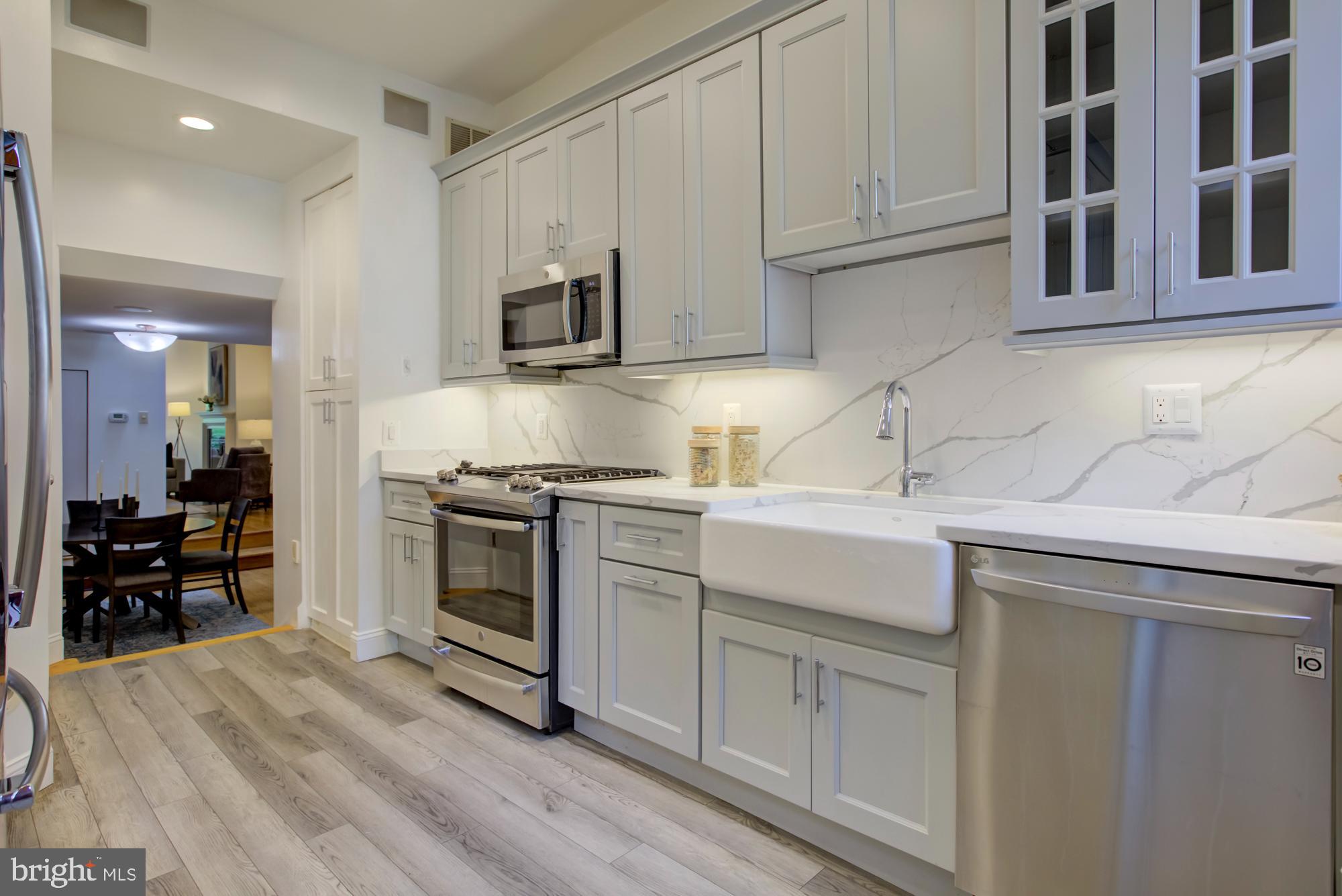 632 C Street Northeast Washington, DC 20002 - Photo 9 of 34 a kitchen with stainless steel appliances granite countertop a sink and cabinets
