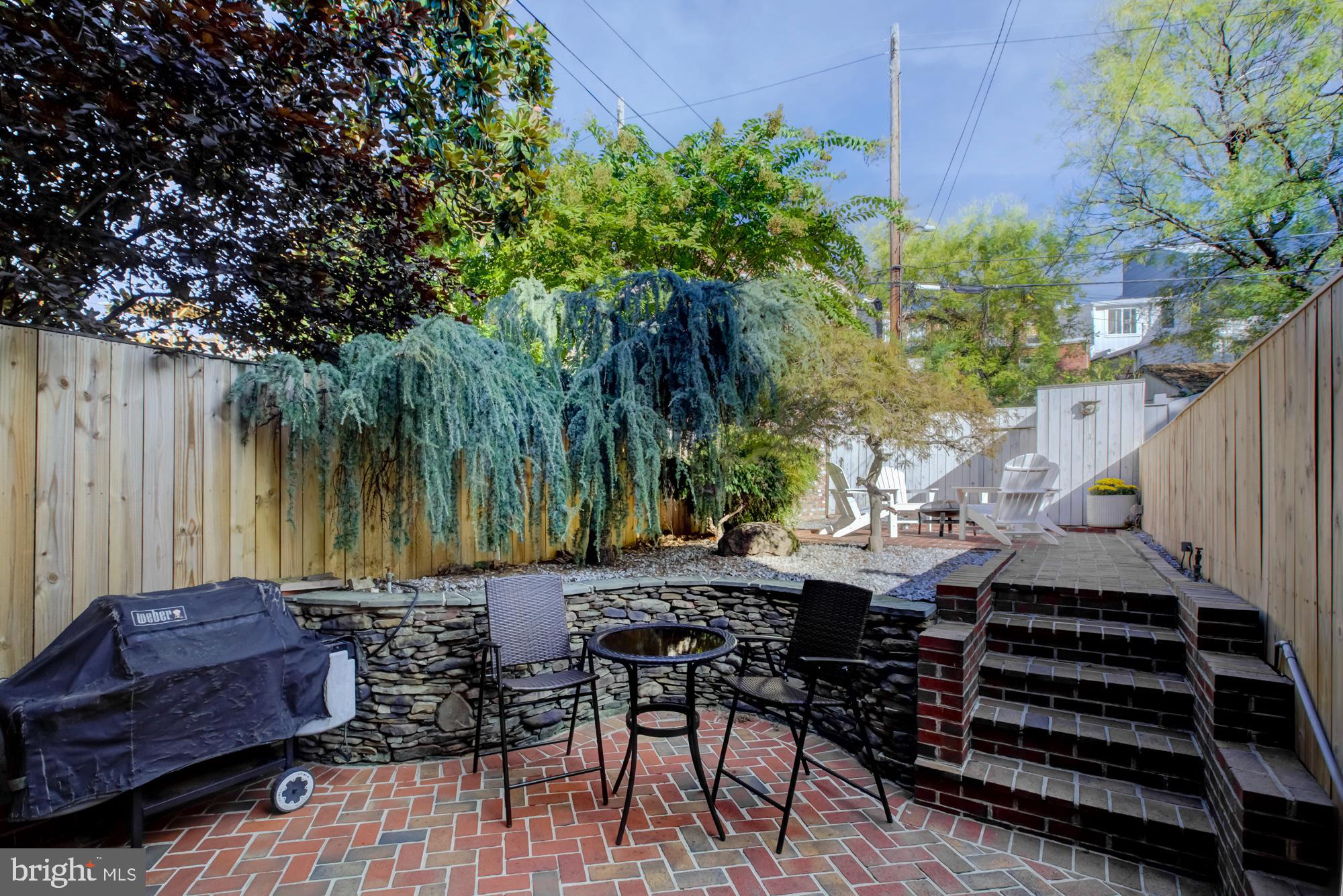 632 C Street Northeast Washington, DC 20002 - Photo 10 of 34 a view of a backyard with furniture and a bench