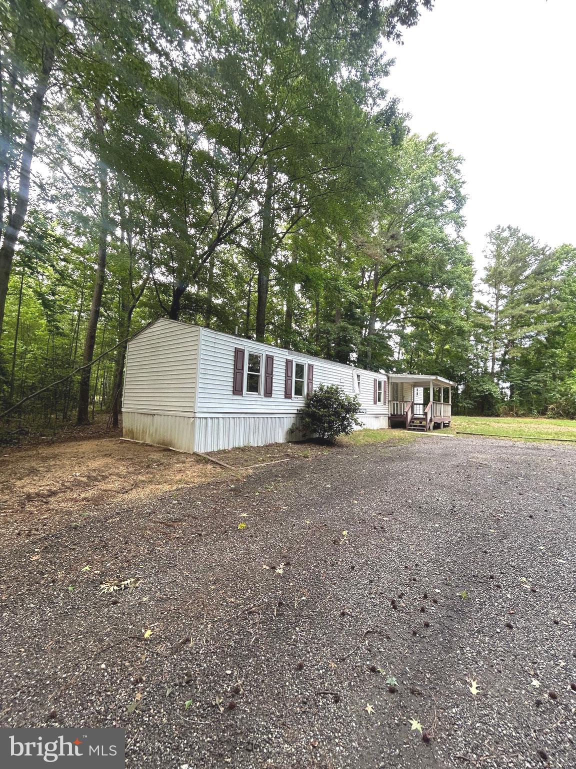 20275 Jackson Road Callaway, MD 20620 - Photo 3 of 7 a view of a house with a yard and garage
