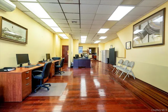 a view of a livingroom with furniture a flat screen tv