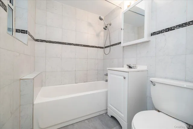 a bathroom with a bathtub and a toilet