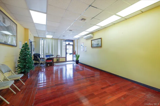 a view of a room with wooden floor