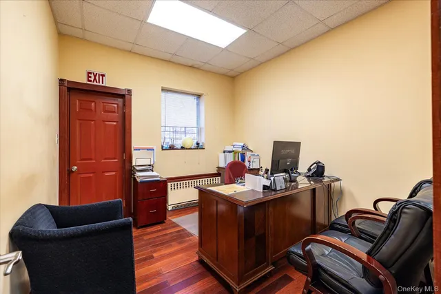 a work room with furniture and wooden floor